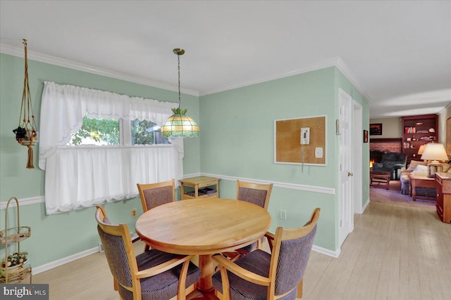 2110 Buckman Ave, Reading, PA 19610 - dining room with light wood finished floors, ornamental molding, and baseboards