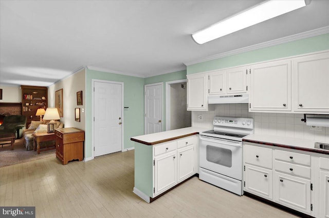 2110 Buckman Ave, Reading, PA 19610 - kitchen featuring white range with electric cooktop, under cabinet range hood, a peninsula, ornamental molding, and white cabinetry