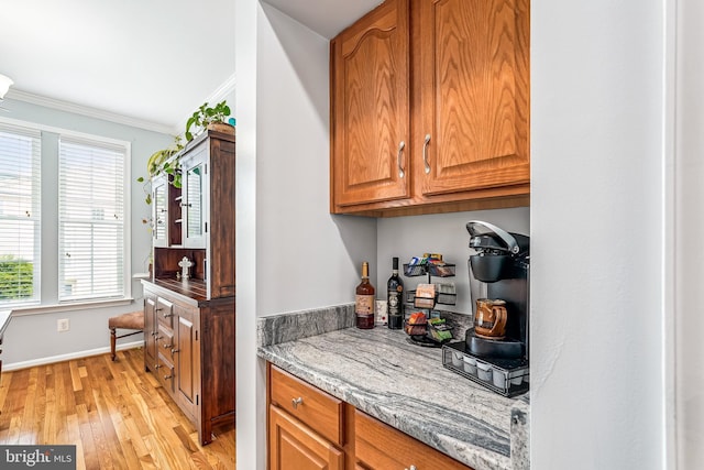 603 Howitzer Ter NE, Leesburg, VA 20176 - indoor dry bar featuring ornamental molding and light wood finished floors