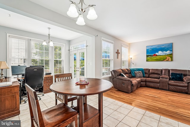 603 Howitzer Ter NE, Leesburg, VA 20176 - dining space featuring a chandelier, light tile patterned floors, and french doors