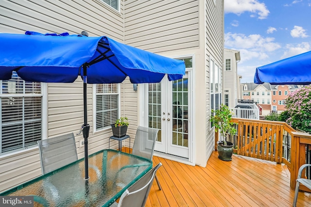 603 Howitzer Ter NE, Leesburg, VA 20176 - wooden terrace featuring french doors and outdoor dining space