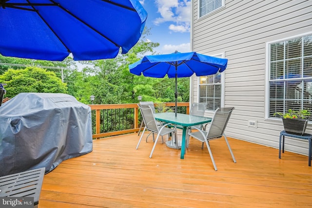 603 Howitzer Ter NE, Leesburg, VA 20176 - deck with outdoor dining area and grilling area