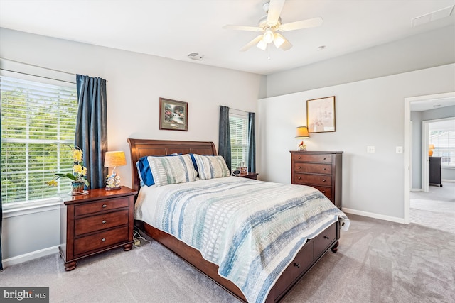 603 Howitzer Ter NE, Leesburg, VA 20176 - bedroom featuring light colored carpet and ceiling fan