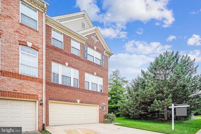 603 Howitzer Ter NE, Leesburg, VA 20176 - view of property featuring an attached garage and concrete driveway