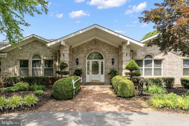 77 Lionheart Ter, Falling Waters, WV 25419 - view of front facade with brick siding