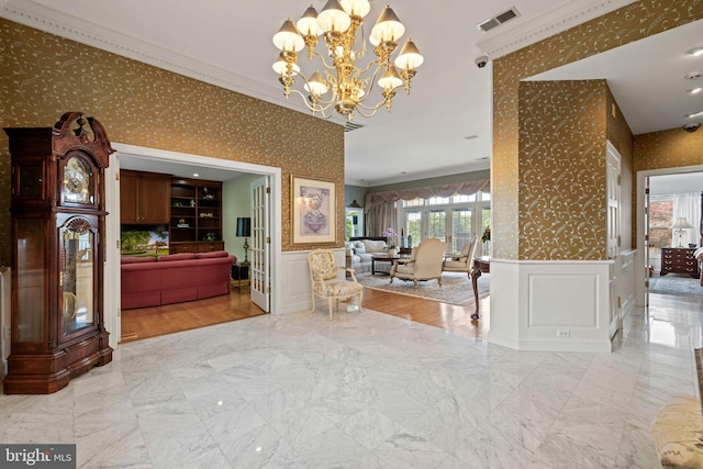 77 Lionheart Ter, Falling Waters, WV 25419 - hall with wallpapered walls, a decorative wall, crown molding, a chandelier, and marble finish flooring