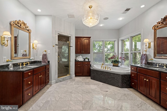 77 Lionheart Ter, Falling Waters, WV 25419 - bathroom featuring two vanities, a garden tub, a shower stall, a chandelier, and marble finish flooring