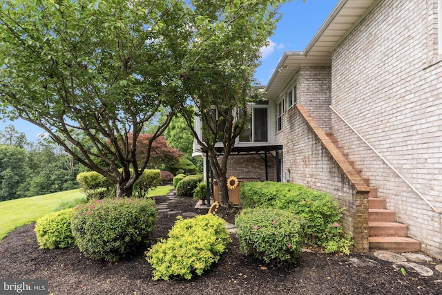 77 Lionheart Ter, Falling Waters, WV 25419 - view of home's exterior with brick siding and stairs