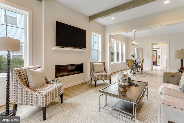 5809 2nd St S, Arlington, VA 22204 - living area featuring wood finished floors, a glass covered fireplace, beamed ceiling, baseboards, and recessed lighting