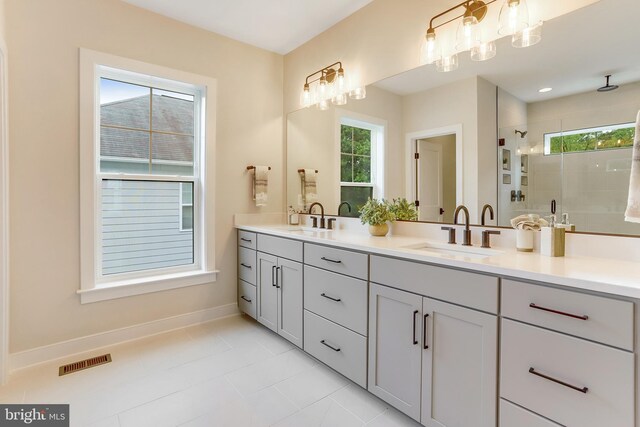5809 2nd St S, Arlington, VA 22204 - full bathroom with double vanity, healthy amount of natural light, a tile shower, and baseboards