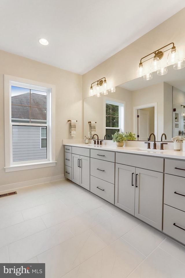 5809 2nd St S, Arlington, VA 22204 - bathroom with double vanity, baseboards, and recessed lighting