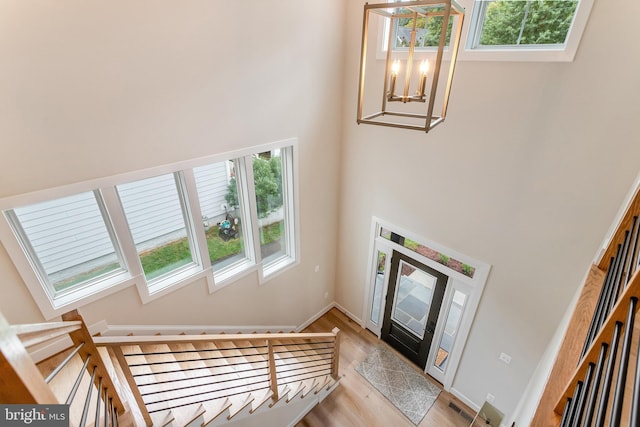 5809 2nd St S, Arlington, VA 22204 - foyer entrance featuring a towering ceiling, a chandelier, light wood-type flooring, a skylight, and baseboards