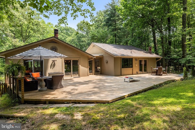 2404 Sugarberry Ct, Reston, VA 20191 - back of property featuring a yard, a chimney, and a wooden deck