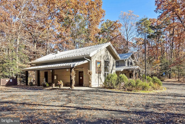 2404 Sugarberry Ct, Reston, VA 20191 - view of front facade with a porch, metal roof, and a standing seam roof