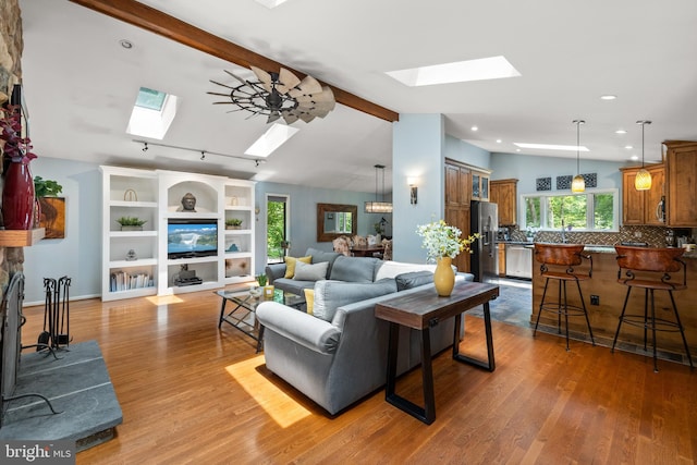 2404 Sugarberry Ct, Reston, VA 20191 - living area with a skylight, wood finished floors, and recessed lighting