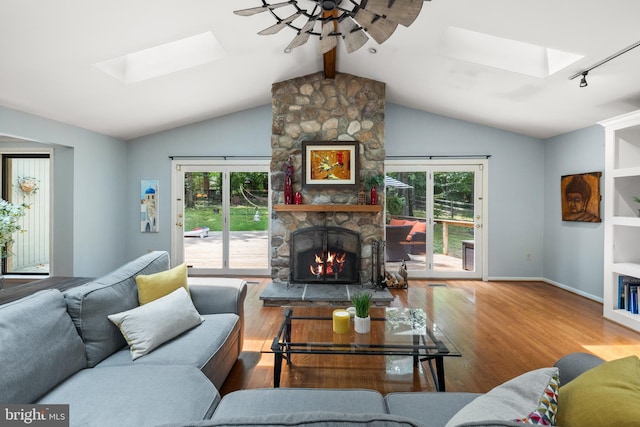 2404 Sugarberry Ct, Reston, VA 20191 - living room featuring a skylight, healthy amount of natural light, wood finished floors, and a ceiling fan