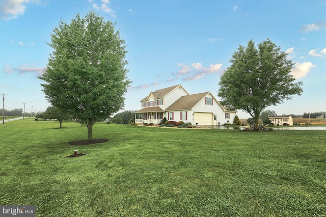 574 Mathias Rd, Littlestown, PA 17340 - traditional-style home with a front lawn, an attached garage, and a porch