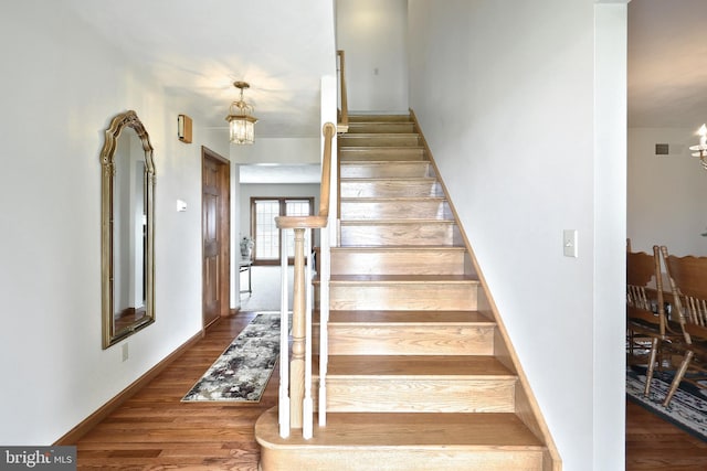 574 Mathias Rd, Littlestown, PA 17340 - stairway with a chandelier and wood finished floors