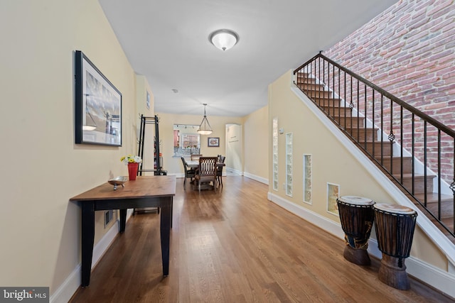 3004 E Pratt St, Baltimore, MD 21224 - hallway featuring wood finished floors and stairway