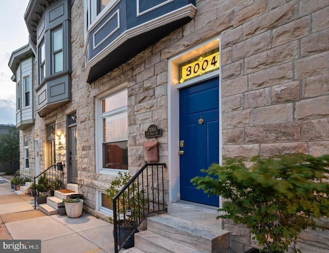 3004 E Pratt St, Baltimore, MD 21224 - doorway to property featuring stone siding