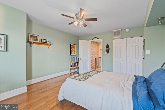 3004 E Pratt St, Baltimore, MD 21224 - bedroom featuring wood finished floors, a closet, and ceiling fan