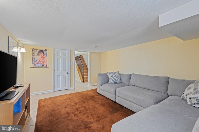 3004 E Pratt St, Baltimore, MD 21224 - living area with light tile patterned floors, stairs, and a textured ceiling