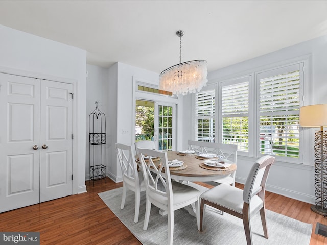 1 Lake Village Cir, Ocean View, DE 19970 - dining area with a chandelier, wood finished floors, and baseboards