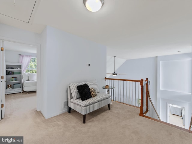 1 Lake Village Cir, Ocean View, DE 19970 - living area with carpet, attic access, an upstairs landing, and a ceiling fan