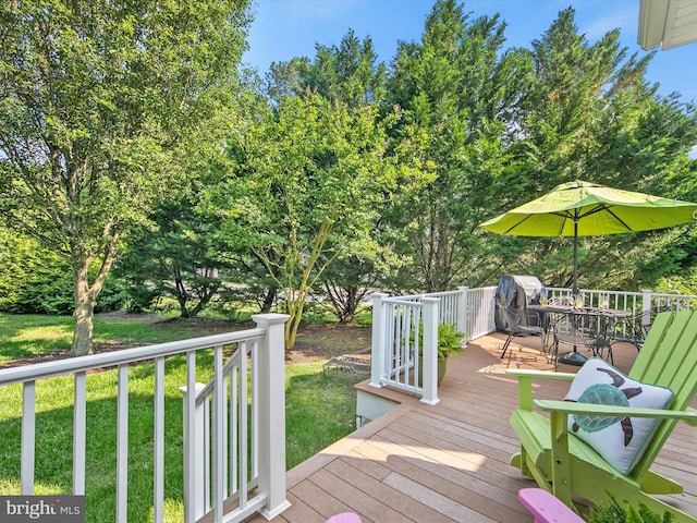 1 Lake Village Cir, Ocean View, DE 19970 - deck featuring outdoor dining space, a lawn, and view of wooded area