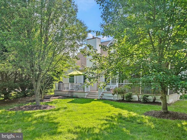 1 Lake Village Cir, Ocean View, DE 19970 - rear view of property with a chimney and a lawn