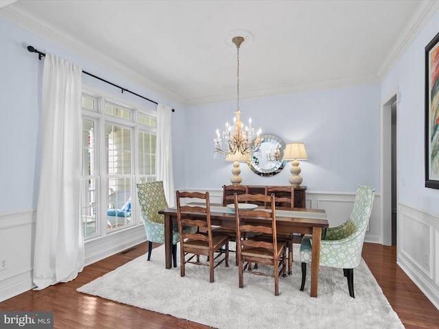 1 Lake Village Cir, Ocean View, DE 19970 - dining space with crown molding, dark wood-type flooring, a chandelier, and wainscoting