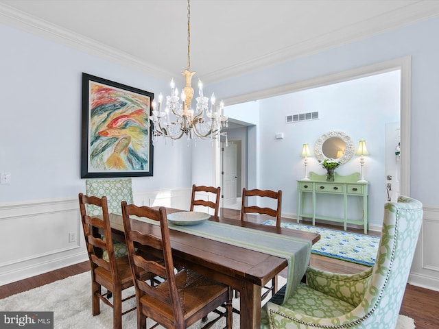 1 Lake Village Cir, Ocean View, DE 19970 - dining space featuring wood finished floors, a chandelier, ornamental molding, and wainscoting