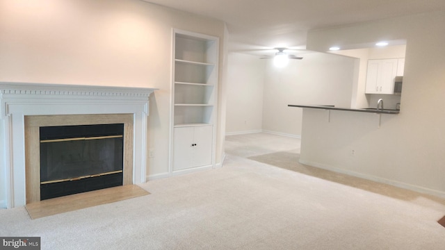 7705 Lafayette Forest Dr Unit 77, Annandale, VA 22003 - unfurnished living room with light colored carpet, ceiling fan, and a fireplace with flush hearth