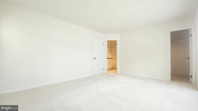7705 Lafayette Forest Dr Unit 77, Annandale, VA 22003 - unfurnished bedroom with a spacious closet, light colored carpet, a closet, and ensuite bath