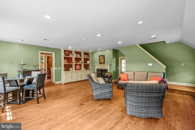 1621 Limekiln Rd, Limekiln, PA 19535 - living area featuring recessed lighting, wood finished floors, a glass covered fireplace, and vaulted ceiling