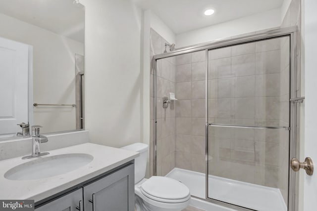 338 Ensemble Way, Frederick, MD 21701 - bathroom featuring toilet, vanity, tiled shower, and recessed lighting