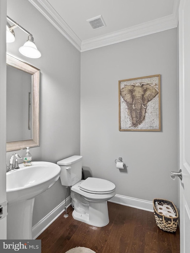 548 E Delp Rd, Lancaster, PA 17601 - half bathroom featuring crown molding and wood finished floors