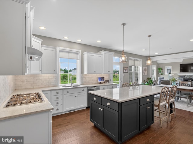 548 E Delp Rd, Lancaster, PA 17601 - kitchen featuring appliances with stainless steel finishes, white cabinetry, open floor plan, tasteful backsplash, and recessed lighting