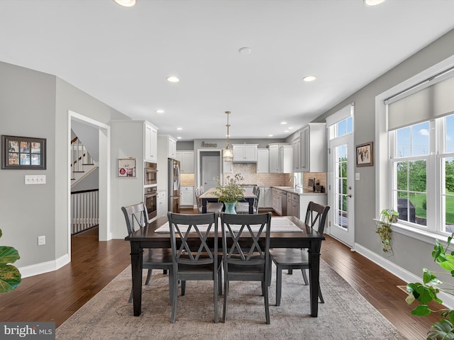 548 E Delp Rd, Lancaster, PA 17601 - dining area with dark wood finished floors, stairway, and recessed lighting