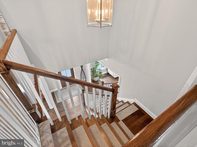 548 E Delp Rd, Lancaster, PA 17601 - staircase with wood finished floors and a chandelier