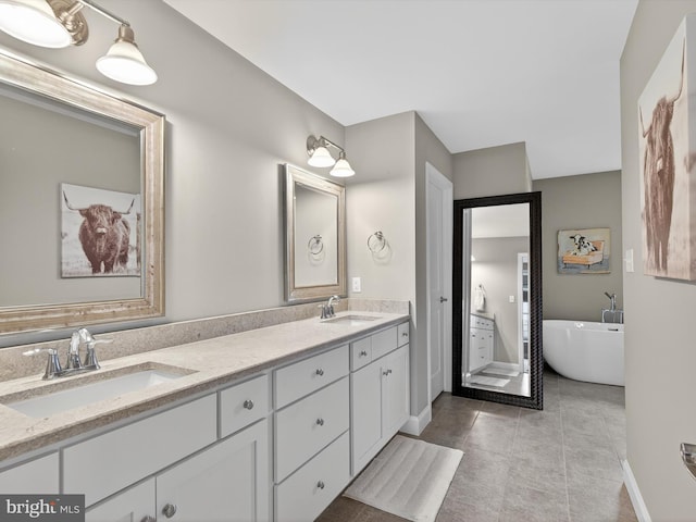 548 E Delp Rd, Lancaster, PA 17601 - bathroom with double vanity, a soaking tub, and tile patterned flooring