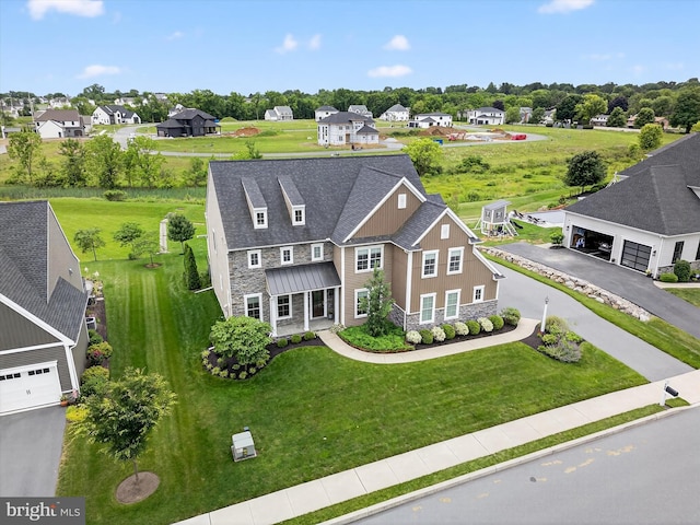 548 E Delp Rd, Lancaster, PA 17601 - view of front facade featuring stone siding, a residential view, and asphalt driveway