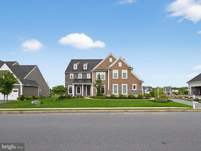 548 E Delp Rd, Lancaster, PA 17601 - view of front of property featuring stone siding, board and batten siding, and a front lawn