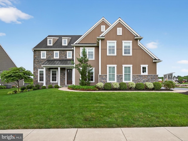 548 E Delp Rd, Lancaster, PA 17601 - view of front of home with stone siding, a front yard, and board and batten siding