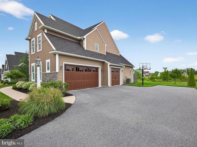 548 E Delp Rd, Lancaster, PA 17601 - view of side of home with driveway, a garage, and roof with shingles
