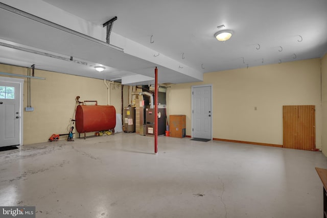 129 Deck Rd, Womelsdorf, PA 19567 - garage with heating fuel, heating unit, and electric water heater