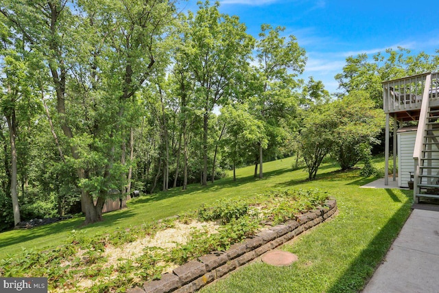 129 Deck Rd, Womelsdorf, PA 19567 - view of grassy yard featuring stairway and a wooden deck