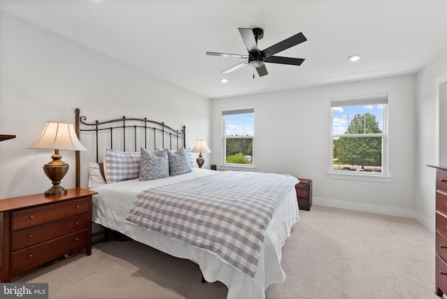 8790 Kensington Church St, Manassas, VA 20112 - bedroom with multiple windows, light colored carpet, baseboards, recessed lighting, and ceiling fan