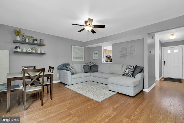 3363 Style Ave, Laurel, MD 20724 - living area with ceiling fan, light wood-style floors, and baseboards