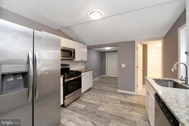 133 E Federal St, Burlington, NJ 08016 - kitchen with appliances with stainless steel finishes, a sink, white cabinets, light wood-type flooring, and light stone counters